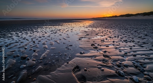 Wallpaper Mural Golden hour descends on the shore, illuminating pebbles and rippled sand with a gentle glow Torontodigital.ca