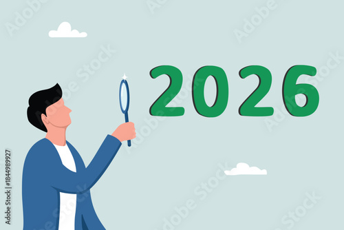 Business prospects for the new year 2026, planning or strategy towards success, vision or forecast, concept of improvement or progress, businessman's view of 2026 with a magnifying glass.