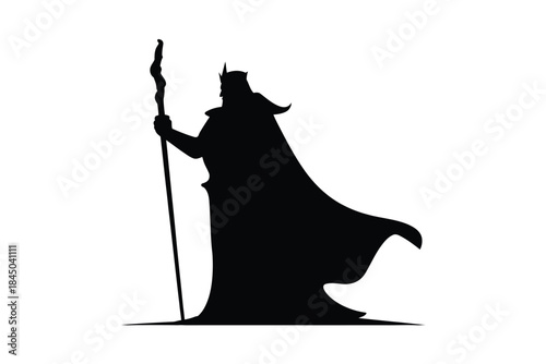 Regal king wearing crown and cape holding staff silhouette