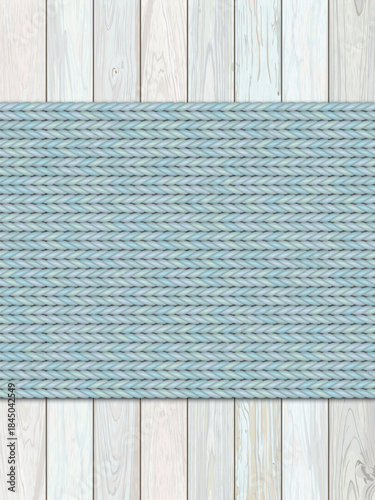 Light blue knitted fabric striped on cut timber pastel color painted distressed weathered vertical background