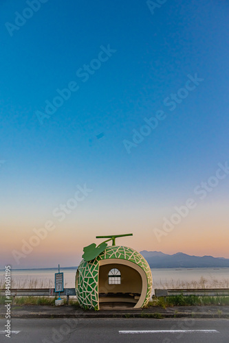 Sunset at a Fruit-Shaped Bus Stop in Nagasaki, Japan – Clear Sky Silhouette at Golden Hour