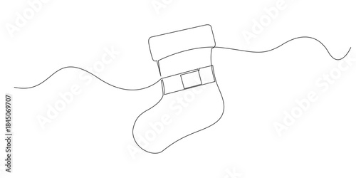 Continuous line drawing of a Santa stocking hanging for gifts symbolizing holiday warmth surprise and festive tradition. Single line illustration suitable for Christmas decoration and winter themes.