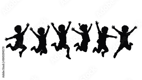 Silhouette of six happy children jumping for joy against a