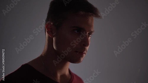 Young angry thoughtful man thinking and contemplating breathing deeply.