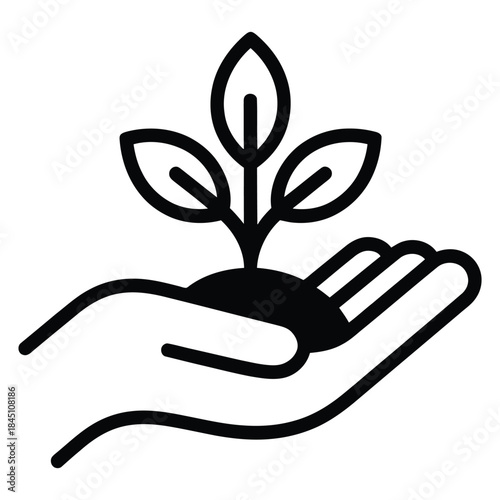 Protecting new growth concept with human hand holding a small green plant sapling sprout gently