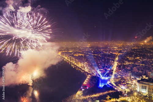 Fototapeta Naklejka Na Ścianę i Meble -  New Year’s Eve Celebration with Fireworks Over Thessaloniki’s Waterfront and Historic Tower