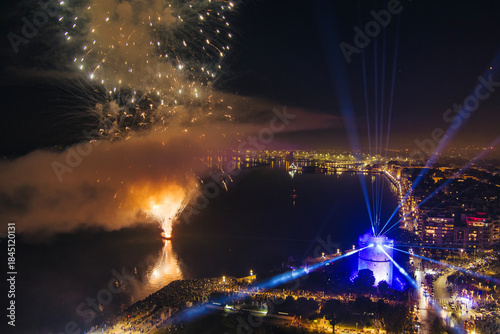 Fototapeta Naklejka Na Ścianę i Meble -  New Year’s Eve Celebration with Fireworks Over Thessaloniki’s Waterfront and Historic Tower