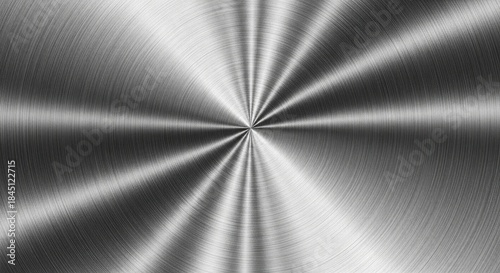 Brushed metal texture featuring a radial pattern and a reflective surface suitable for backgrounds and industrial design projects.