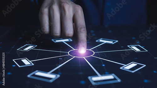 Human finger touching an illuminated glowing digital network hub connecting multiple data nodes on a dark tech background representing global communication and big data concepts
