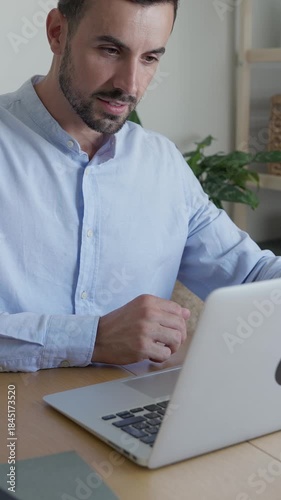 Freelancer typing on laptop and drinking coffee
