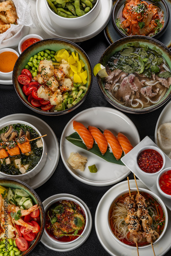 A large table with Asian cuisine