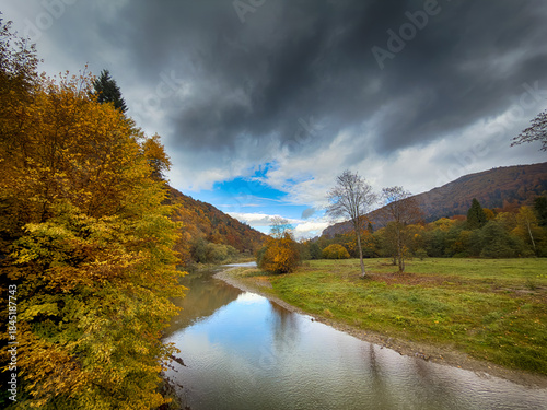 Sunny Autumn Carpathians with Puffy White Clouds