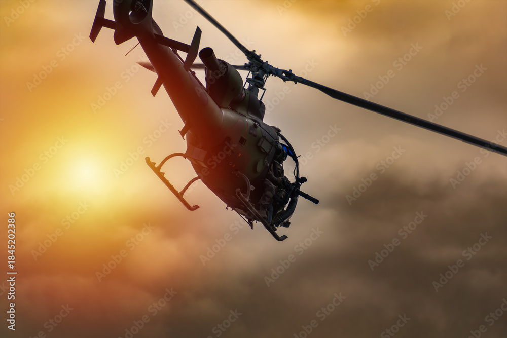 Obraz premium Silhouette of a combat helicopter in the sky, gazelle seen from underneath, air transportation