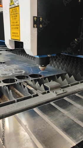 Laser cutting machine. Working process of laser cutting machine. Powerful laser beam for cutting. Cut stainless steel metal. Metal cutting machine. High precision, creating complex shapes CNC Vertical