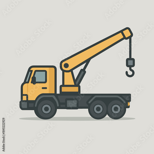 Heavy duty tow truck with crane hook extended on flatbed