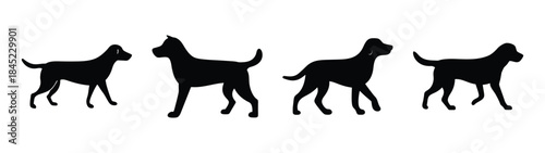 Four black dog silhouettes walking in a row side view