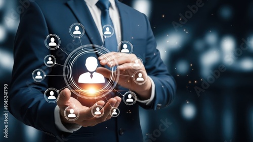 Businessman holding glowing network of user icons above hands