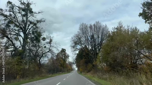 The driver is speeding along an empty highway
