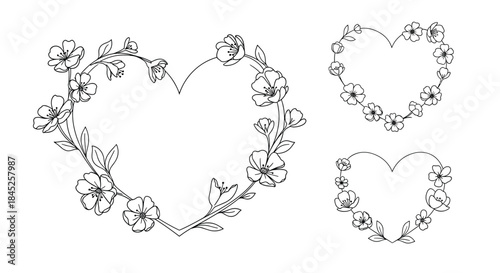 Collection of three beautiful hand-drawn heart-shaped frames decorated with delicate spring flowers in a minimal black and white style.
