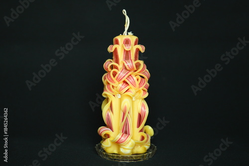 Tableau sur toile Handcrafted carved candle created from layered colored wax decorative art