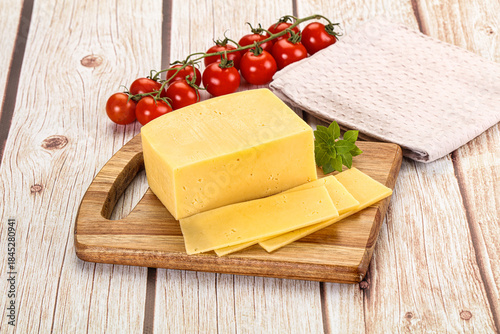 Yellow cheese piece with slices