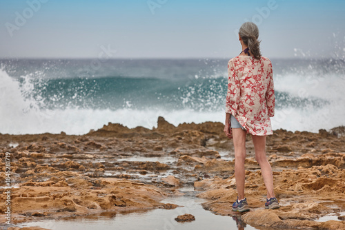 Mature woman looking the sea. Retiremet pensioner elderly. Relaxing lifestyle