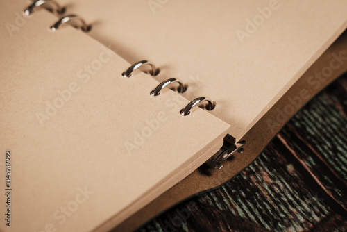 blanc empty eco-friendly paper pager of a vintage leather cover note book or diary, sailor, masculine concept, ready to write wish list or travel adventuries notes