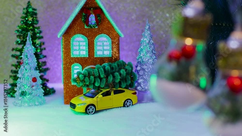 On a light brown background, an orange-blue house with Christmas trees and a car nearby and large lights decorated inside in the foreground