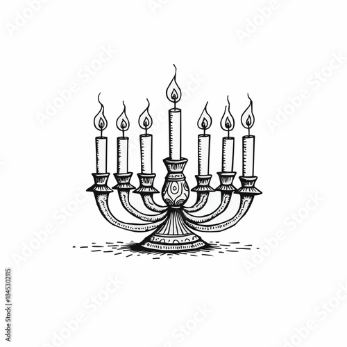 Decorative kinara with seven candles lit for Kwanzaa celebration  