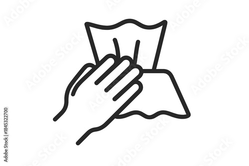 Human hand holding disposable wet wipe or cleaning cloth for hygiene and sanitation