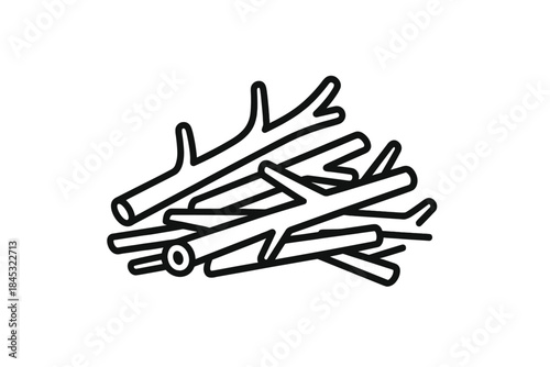 Stack of dry wooden logs and branches used as firewood for heating or a campfire