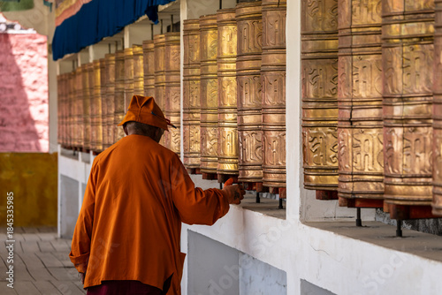 spinning giant prayer wheels, Tagong temple, Tagong Grassland, Garzê Tibetan Autonomous Prefecture, Sichuan,  China