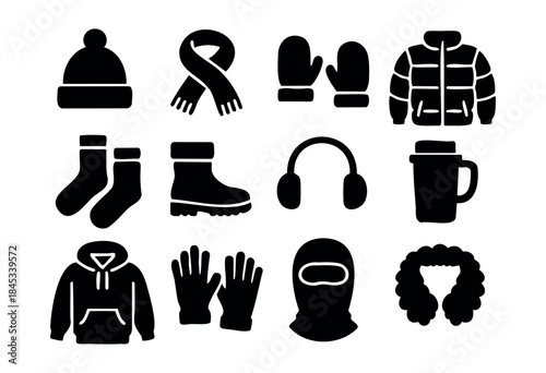 A collection of black silhouette icons representing various cold weather apparel and essentials for winter season — stock vector.