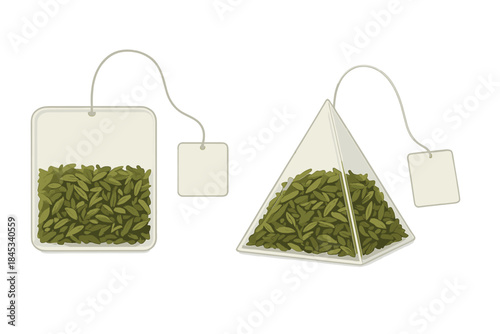 Two different types of tea bags filled with green tea leaves and blank labels on strings