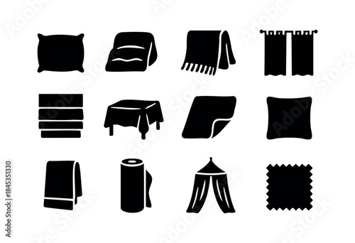A comprehensive set of black silhouette icons depicting various textile products for home decor and furnishings, including bedding, towels, curtains, and rugs — stock vector.