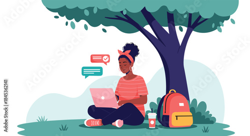 Young student sits under a large tree with a laptop open to study and chat online with friends beside a colorful backpack and a takeaway drink.