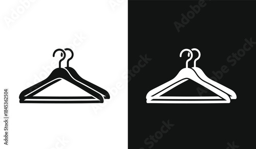 A striking black and white composition features a simple clothing hanger silhouette duplicated and contrasted for visual impact and design high quality professional