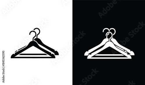 A striking visual comparison showcasing two identically shaped black and white clothing hangers against contrasting backgrounds highlighting duality high quality professional detailed modern
