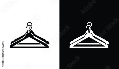 A striking visual contrast depicts two identical clothing hangers one against a stark white background and the other on black high quality professional
