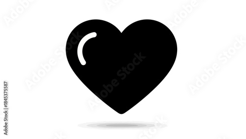 Minimalist black heart icon with subtle shadow emphasizing simplicity and emotional expression