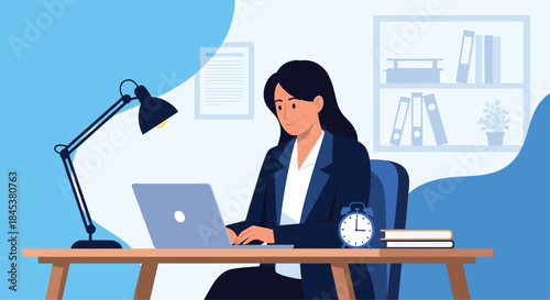 Professional businesswoman in a suit working diligently on her laptop at a modern office desk with a lamp and books nearby.