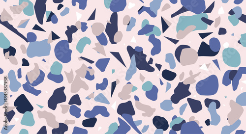 A vibrant and abstract seamless terrazzo pattern with colorful chips in various shades of blue and purple on a pink background.