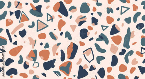 Seamless terrazzo pattern with a mix of abstract organic shapes and triangles in a modern, earthy color palette for stylish decor.