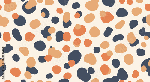 Modern seamless pattern of abstract, scattered spots in a trendy color palette of orange, beige, and navy, resembling animal print.