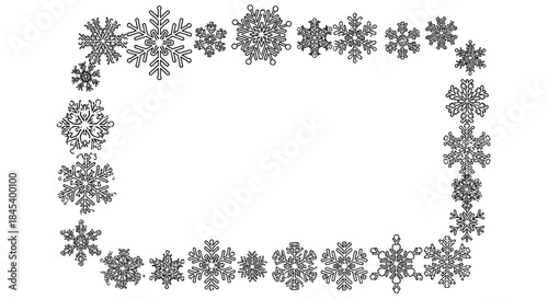Intricate black snowflake border frames a spacious white center suitable for invitations seasonal banners and decorative prints.