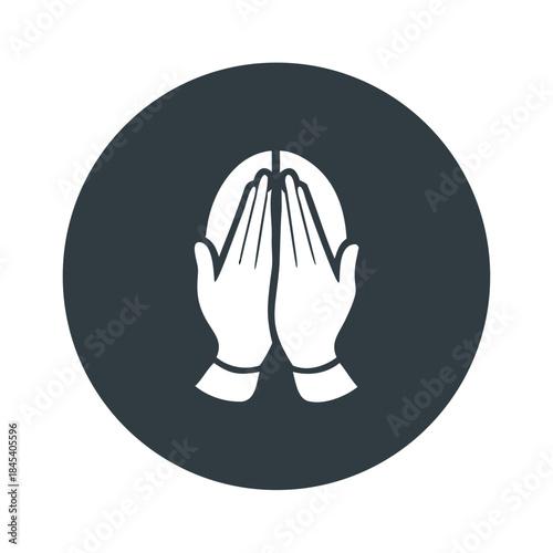 Hands pressed together in prayer symbol on dark circular background  