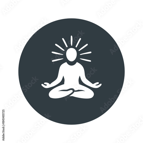 Abstract silhouette of a person meditating with light rays  