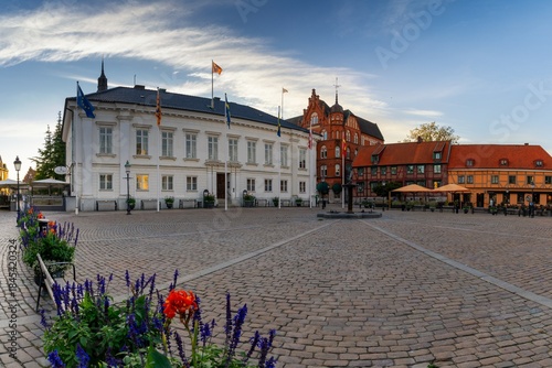 the Ystad city hall and Stortoget market square in warm evening light