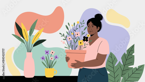 A woman with dark skin and a bun in her hair, wearing a pink shirt, holding a pot of colorful flowers, surrounded by other houseplants and abstract shapes.