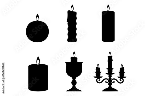 A set of antique gold candles on a candlestick for a vintage Christmas holiday decoration